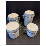 Four Piece White Ceramic Storage Canister Set with Metal Latch Closures