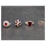 Group of Four Red and White Stone Silver-Tone Rings