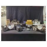 Assorted Cameras, Flashbulbs, and Wooden Spool