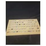 Jewelry Array Displayed on Foam Board Featuring Various Gemstone Rings