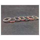 Set of Seven Eternity Bands with Red and Black Round Cut Stones