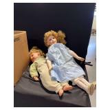 Two Porcelain Dolls with Fabric Clothing