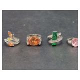 Group of Four Fashion Rings with Colored Gemstones and Silver Tone Metal Settings