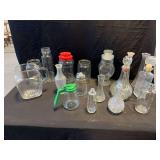 Assorted Glassware Including Decanters, Jars, and Vases