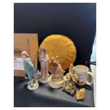 Mixed Decorative Assortment Including Figurines, Pillow, and Mug