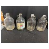 Four Glass Jugs with Handles