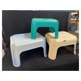 Three Plastic Step Stools in Blue, Teal, and Beige