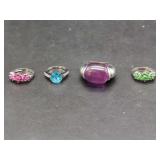 Four-Piece Gemstone Ring Assortment with Colored Stones and Metal Settings
