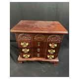 Wooden Jewelry Armoire with Carved Shell Details and Contents