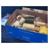 Craft Supply Assortment Including Yarn Spools and Wooden Rings