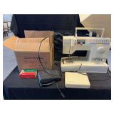 Singer Sewing Machine with Case and Accessories