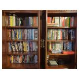 Assorted Media Library Featuring VHS Tapes, DVDs, and Blu-rays in Wooden Cabinet