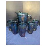 Blue Iridescent Carnival Glass Water Pitcher and Six Tumblers