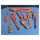Assorted Red Painted Pipe Wrenches Including Fuller and Award Brands
