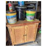 Wooden Workshop Cabinet with Concrete Repair Products and Automotive Supplies
