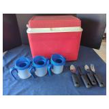 Red Plastic Cooler with Three Blue Mugs and Four Utensils