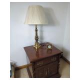 Wooden Nightstand with Brass Lamp and Quartz Clock