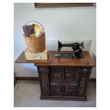 Singer Model 66 Sewing Machine in Carved Wooden Cabinet with Accessories and Fabric