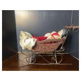 Porcelain Doll in Wicker Sleigh with Iron Frame