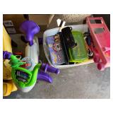 Assorted Toys and Games Lot Featuring Fisher-Price Exercise Bike and Storage Bin