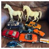 Mixed Toy Lot Including Model Cars, Plastic Horses, and Glass Figurine