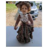 Collectible Porcelain Doll with Plaid Dress and Hat