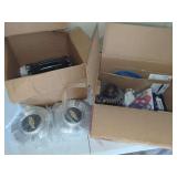 Automotive Parts Assortment Including Alternator, Seatbelt Component, Hubcaps, Fel-Pro Gaskets, Ignition Coils, Radio, and Brake Shoes