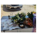 Household and Decorative Assortment with Textiles, Floral Arrangements, and Mirror
