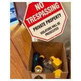 Box of Flashlights and No Trespassing Sign