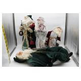 Four Decorative Santa Figures