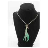 Gold Tone Green Articulated Giraffe Pendant &