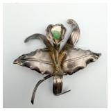 Silver Orchid Flower Brooch with Green Stone