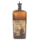 12" Amber Oil Spike Bottle w/Partial Label