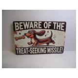 BEWARE OF THE TREAT SEEKING MISSILE SIGN