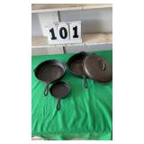 3 black cast iron skillets