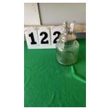 glass ribbed canister with a metal lid