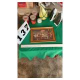 9 items (2 irons, 4 candles, pitcher, clock and