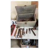 Old aluminum cooler full of tools
