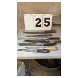 7 kitchen knives and 2 bottle openers