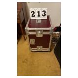 heavy-duty maroon flight case used for