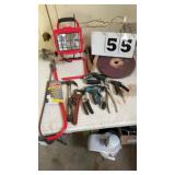 Toilet snake, pipe wrench, hammer, shop light