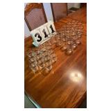 17 matching juice glasses and 18 glasses