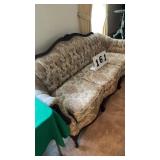 Appears to be an antique Victorian-style sofa.