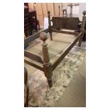 Appears to be a small cannon ball double bed