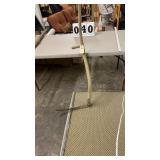 vintage agricultural hand tool known as a scythe