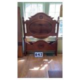 vintage Victorian-style carved wooden bed frame