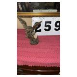 show a cold-cast bronze or resin figurine of