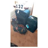 4 pieces of luggage. 2 matching pieces. In very