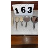 Vintage ladyï¿½s hand mirror, comb and brush.
