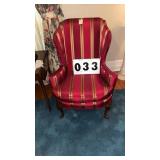 wingback armchair features striking magenta and